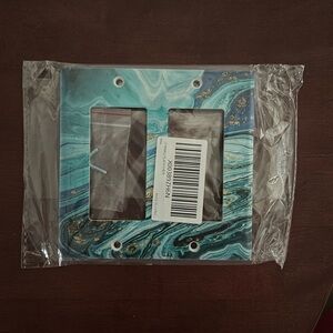 Marble blue toggle light switch cover.